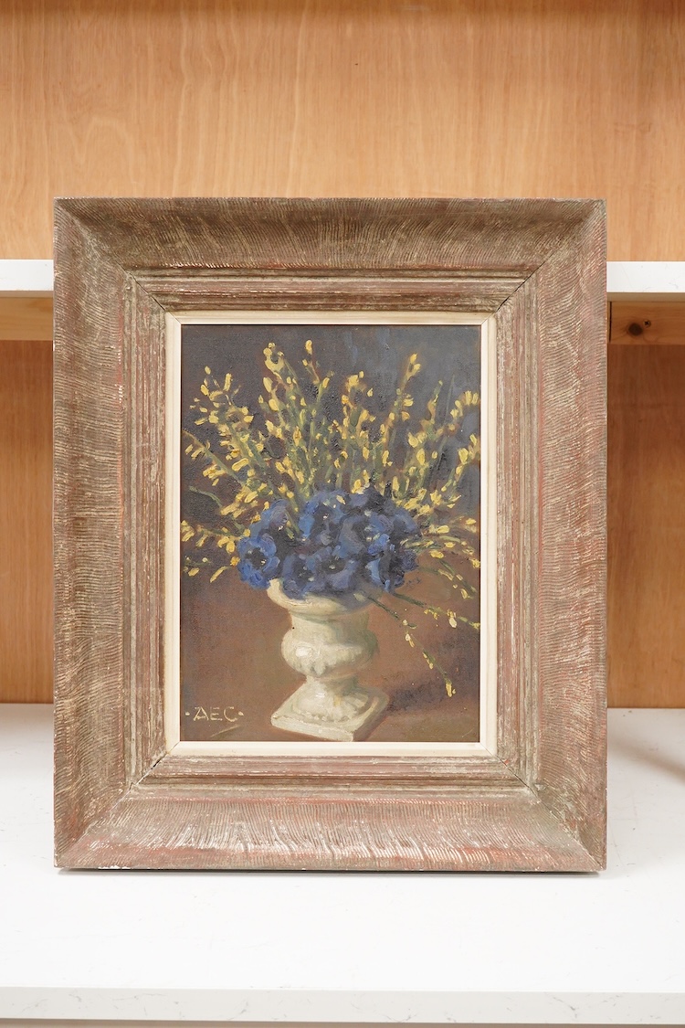 Alfred Egerton Cooper (1883-1974), Still life study of flowers in an urn-style vase, monogrammed lower left, oil on a Windsor & Newton 'Rathbone' canvas board, 33cm x 24cm